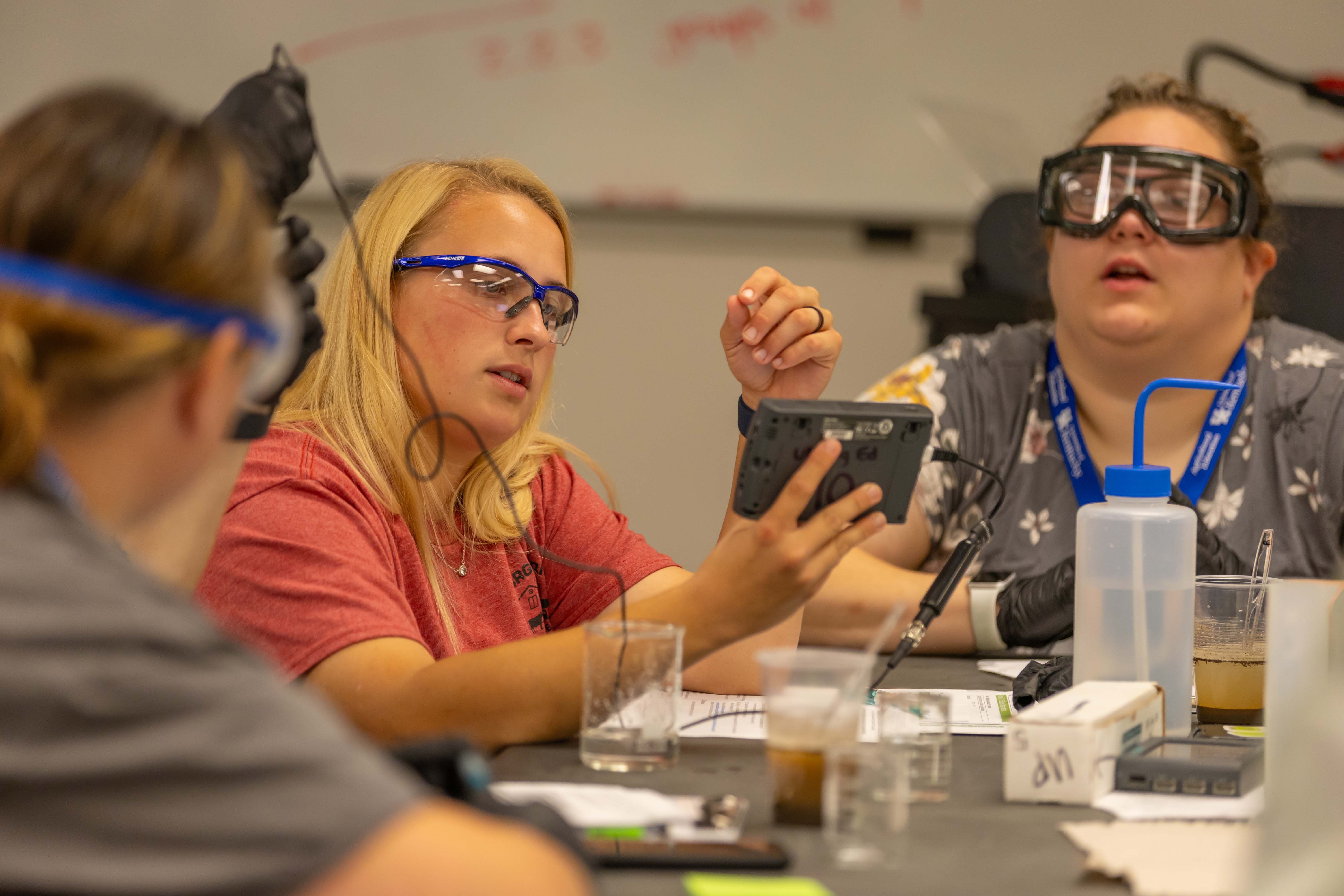 Students working on electronic tools in the lab