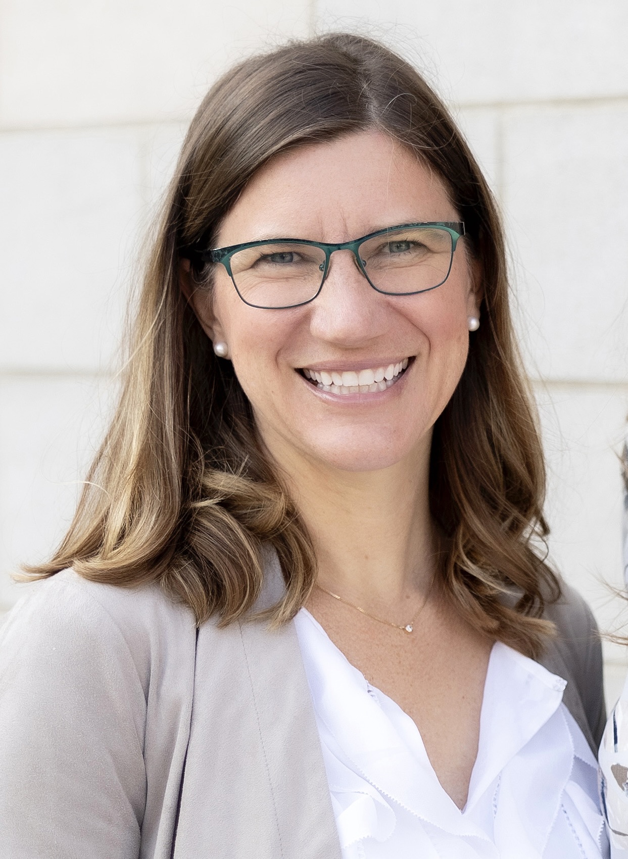 Portrait of Nicole Breazeale against a white wall