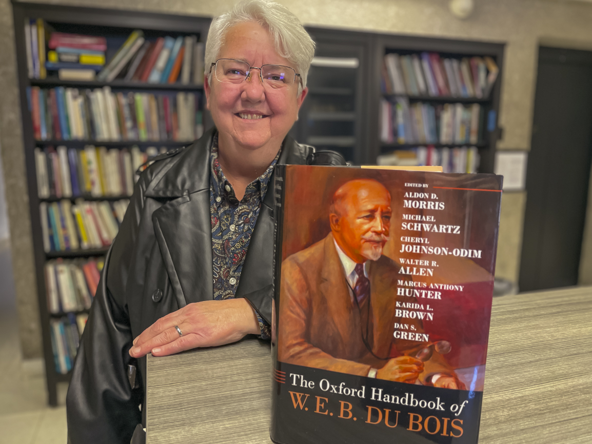 Julie Zimmerman with the Oxford Handbook of W.E.B. Du Bois